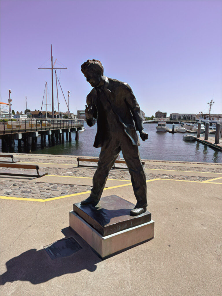 A bronze statue of jack London in jack London square, Oakland, CA
